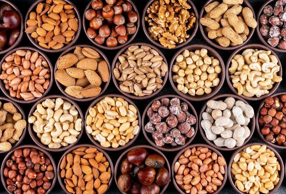 Assorted nuts and dried fruits in bowls